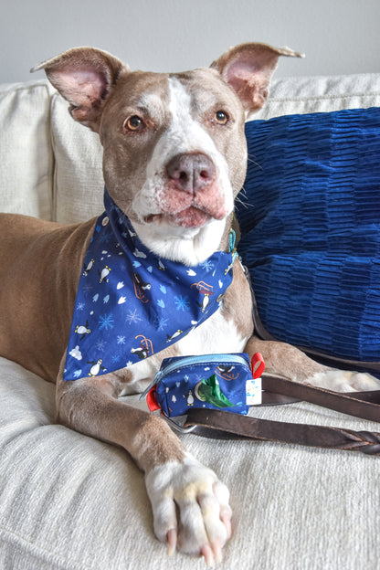 Cute holiday bandana for your pet, dogs and cats too! Complete with cute penguins running a holiday muck with snowball fights and ridding sleighs down the snowy hill!