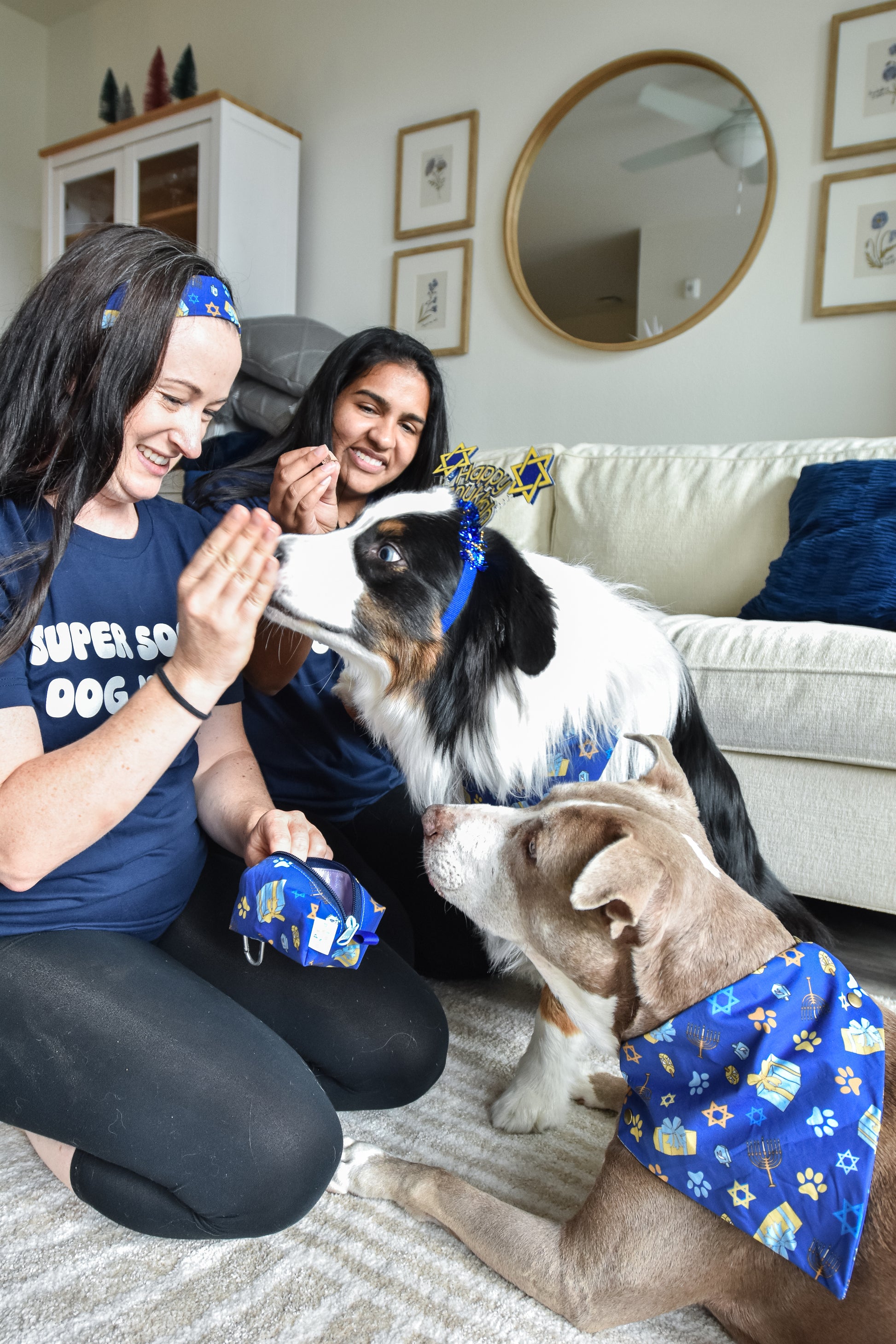 henry celebrating pawnukkah by sneaking some treats out of his cute holiday themed treat pouch with a food safe lining to keep his treats safe and fresh!